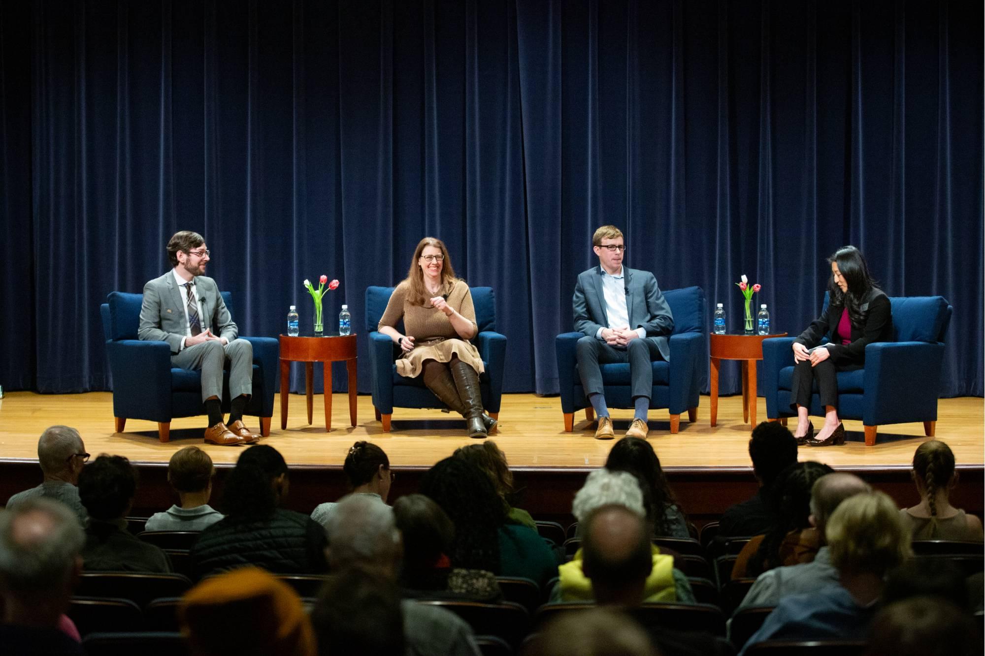 four people on a stage